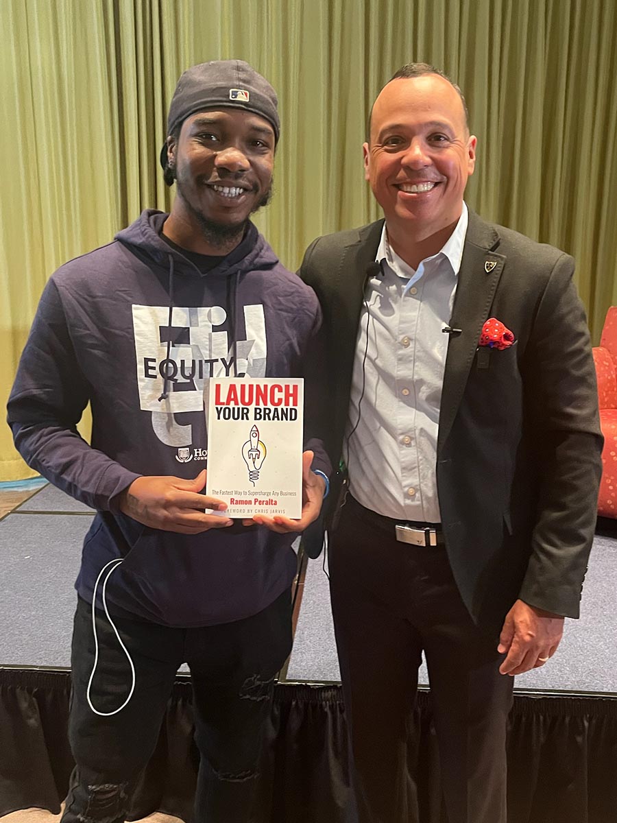 Ramon Peralta, Jr. (right) stands with a budding HCC student entrepreneur.