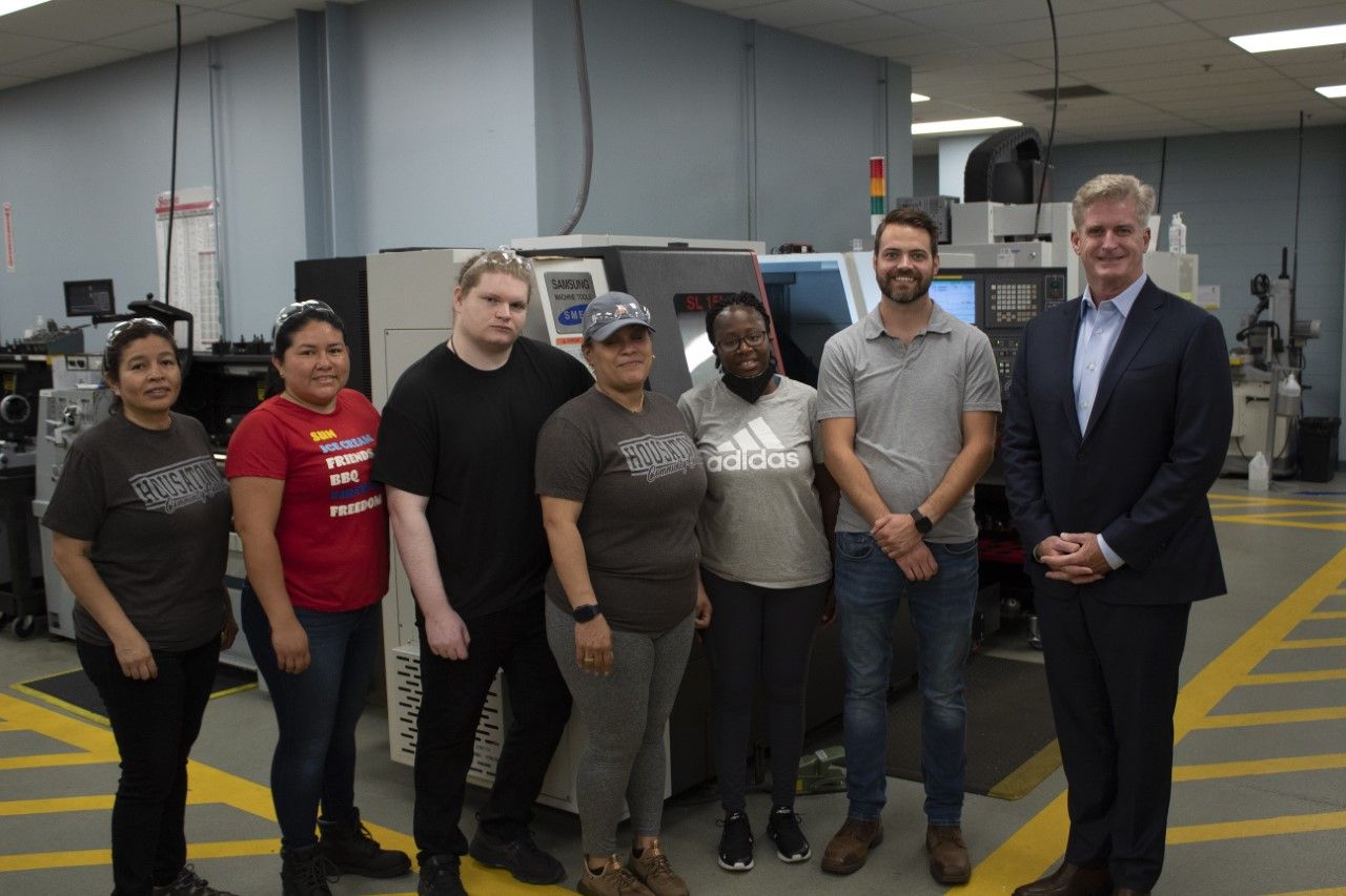 Far right: Bill Tommins, president, Bank of America Southern Connecticut, stands next to Adam Scobie, HCC Assistant Professor of Manufacturing Technology and a number of students in HCC&rsquo;s Advanced Manufacturing program.